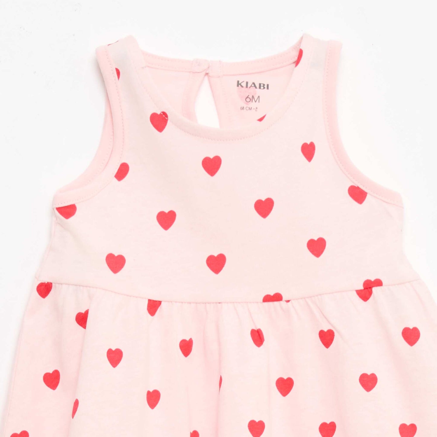 Sleeveless dress with message PINK