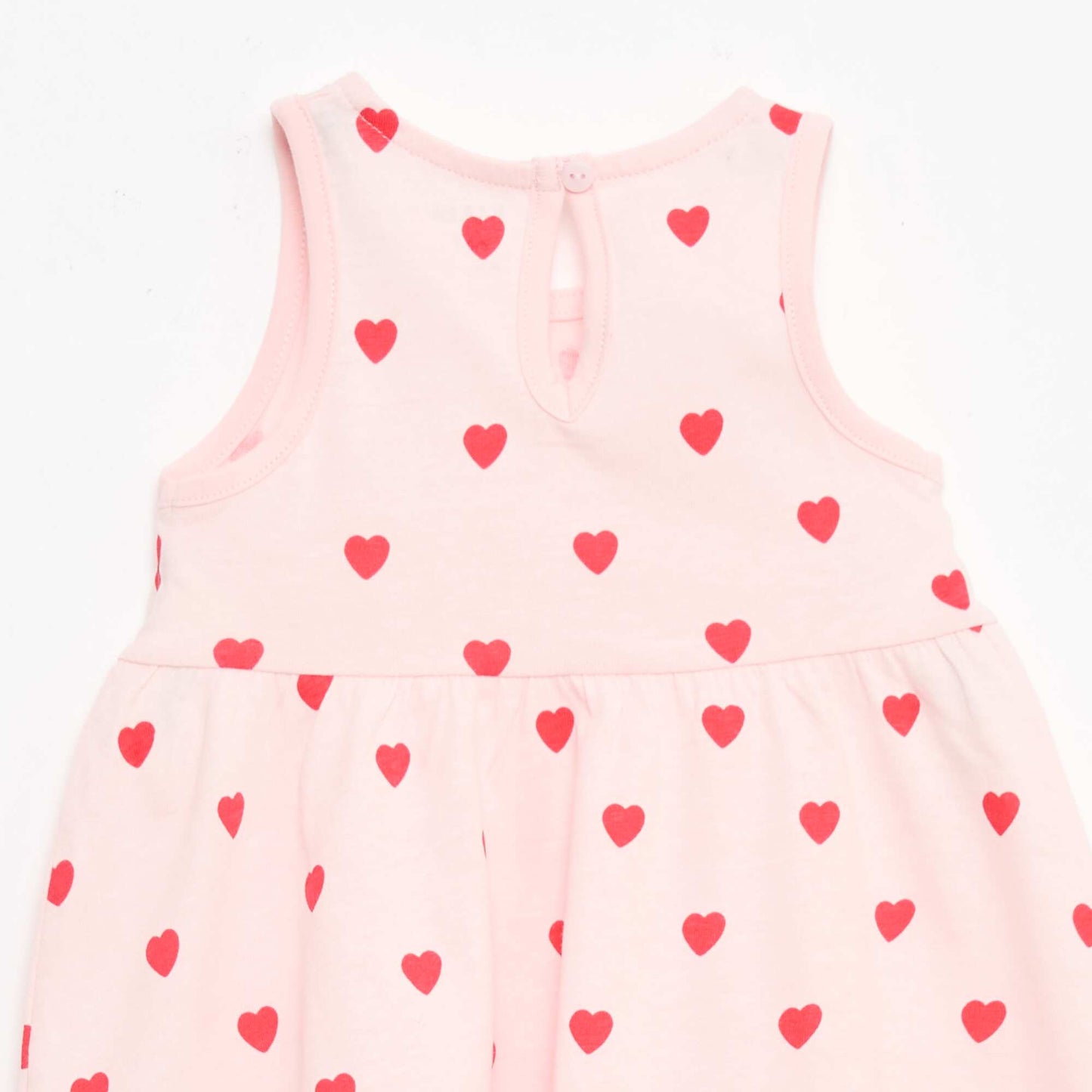 Sleeveless dress with message PINK